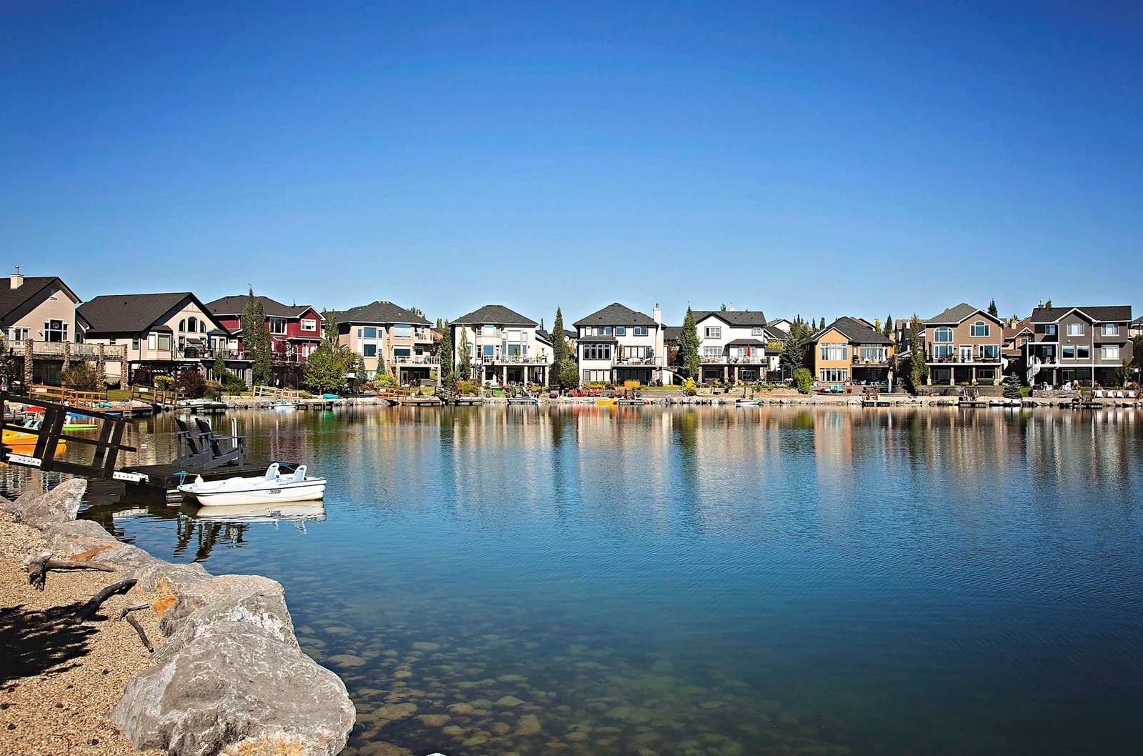 Crystal Shores lake lined with lakefront homes, Okotoks' only lake community