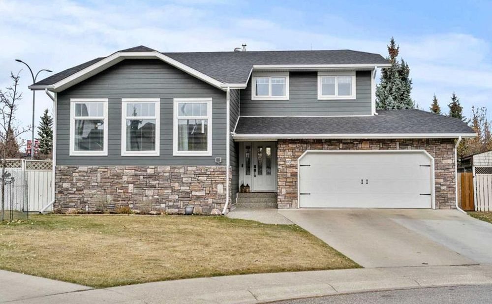 Two-storey family home on a tree-lined street in north Okotoks, sold by TJ Hart-Anderson