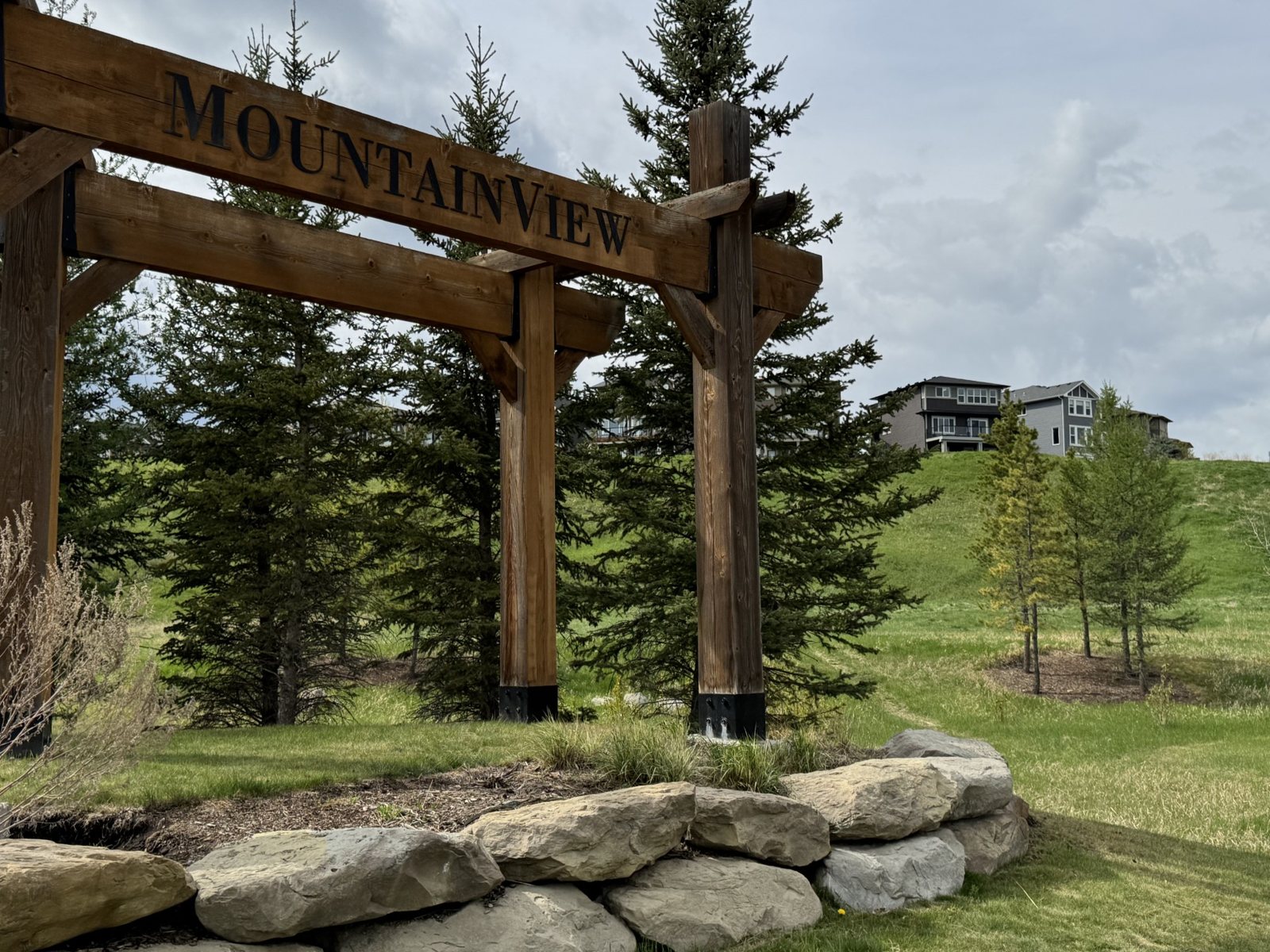 Mountainview neighbourhood entrance and homes above the Sheep River valley in Okotoks