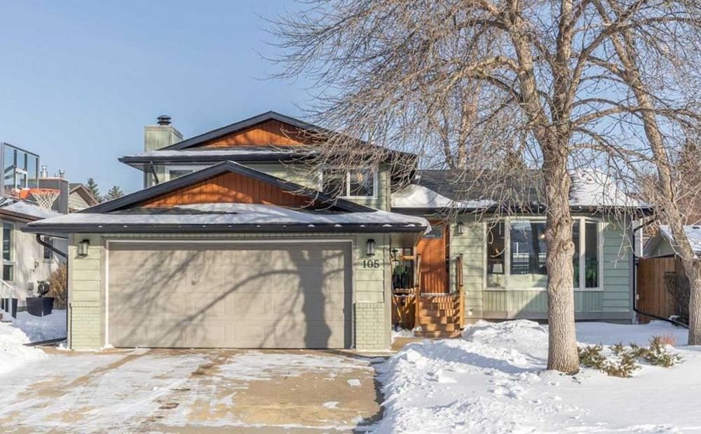 Two-storey home with a mature tree in Woodhaven, Okotoks, sold by TJ Hart-Anderson